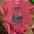 T-shirt with "WARNING: MAY CAST SARCASM AT WILL" and witchy graphics.