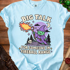 Light blue t-shirt with "Big Talk For Someone In Fireball Range" and a cartoon wizard.