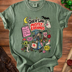 Green t-shirt with "Quest Log: Mostly Errands" cartoon art featuring a witch, goblin, and ghost.