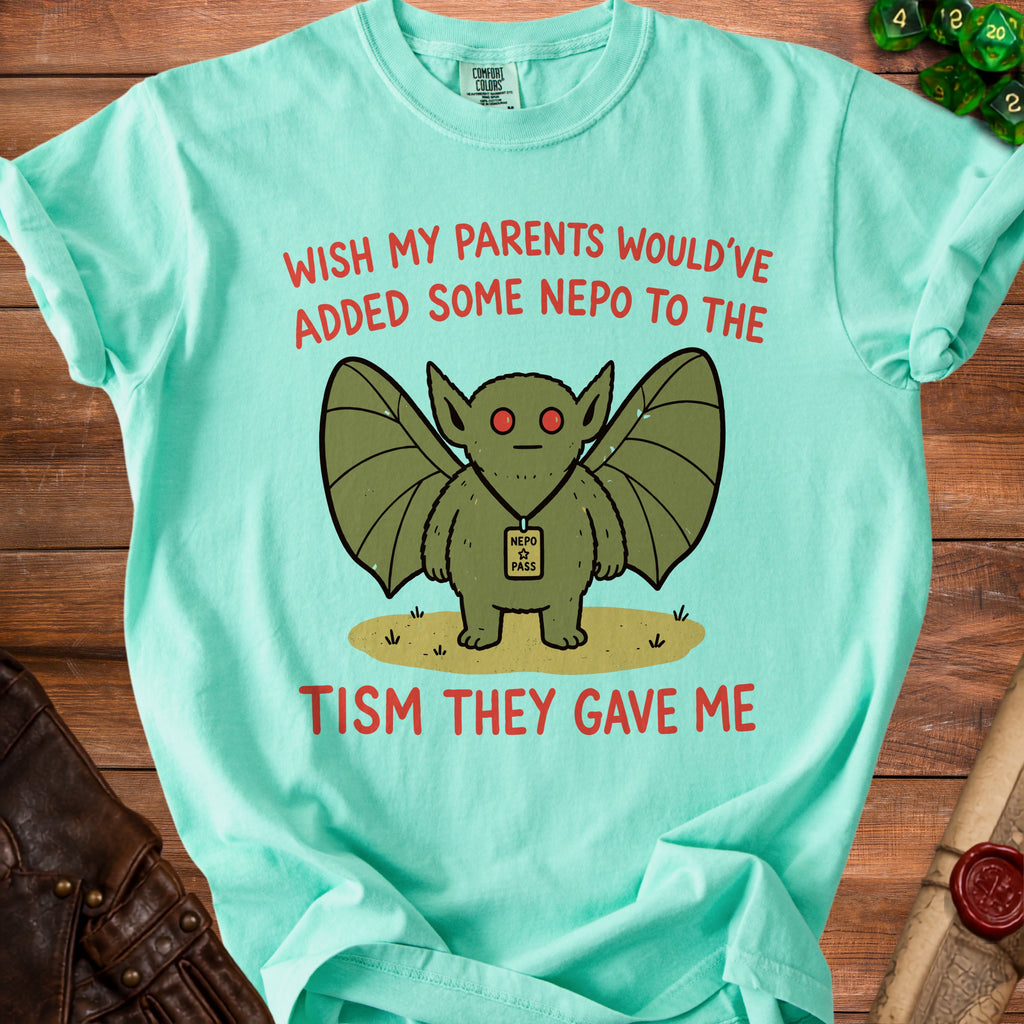 Mint t-shirt with winged creature graphic and text "wish my parents would've added some nepo to the tism they gave me".
