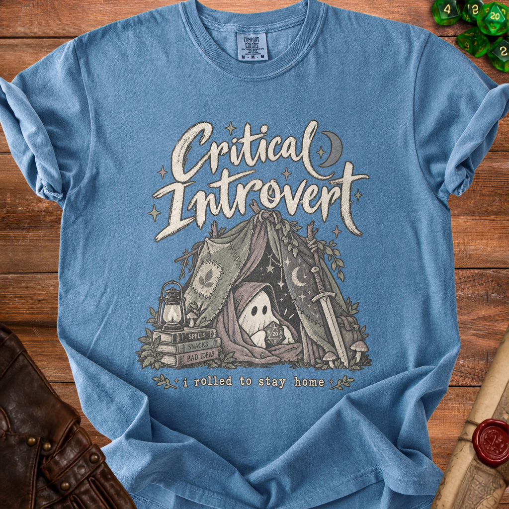 Blue t-shirt with "Critical Introvert" text, ghost in a tent, and dice.
