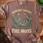 Brown t-shirt with a sleeping goblin, snail, and text "EMERGENCY CONTACT: THE MOSS".