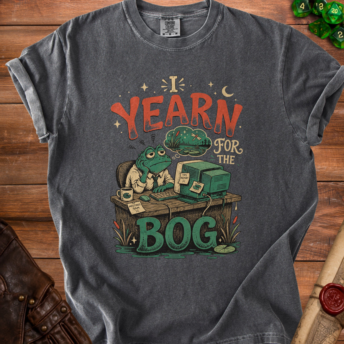 T-shirt graphic of a frog at a desk yearning for the bog.