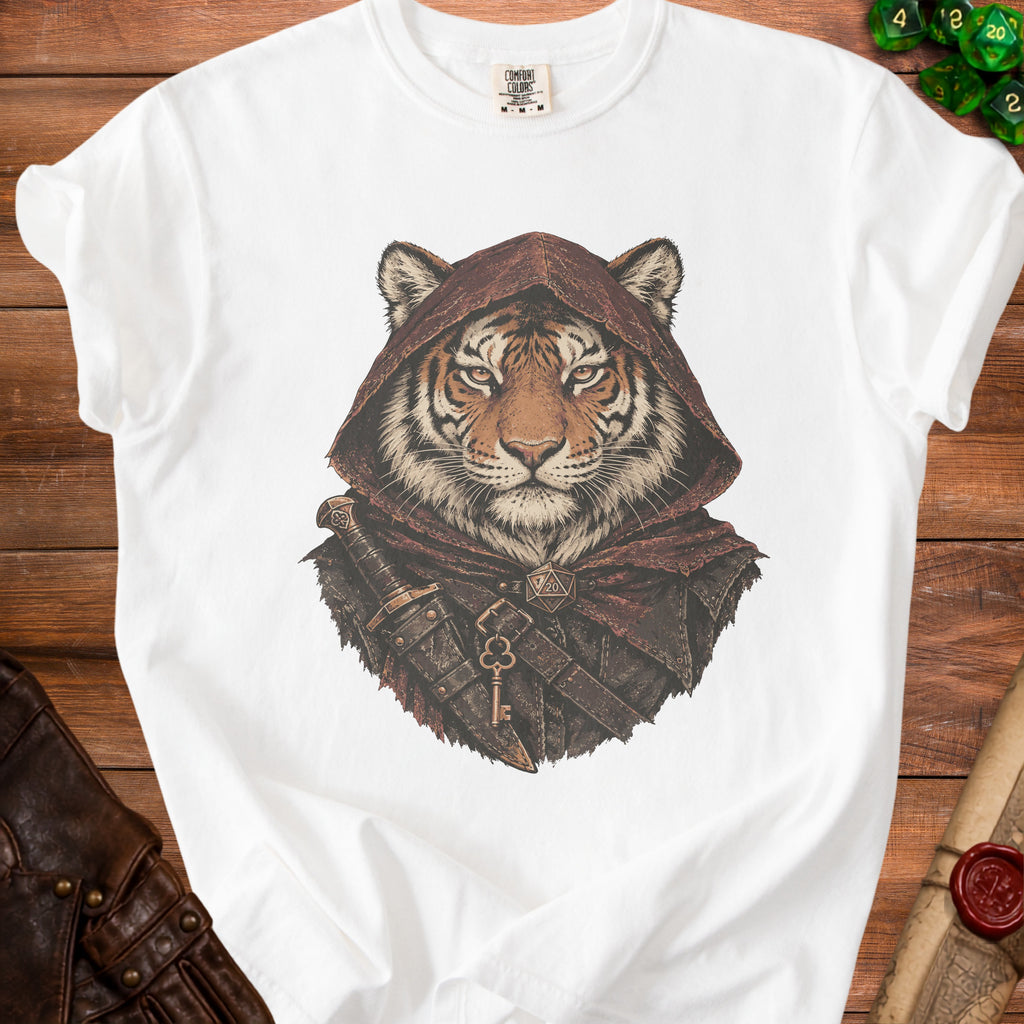 White t-shirt displaying a graphic of a tiger wearing a hooded cloak, dagger, and key.