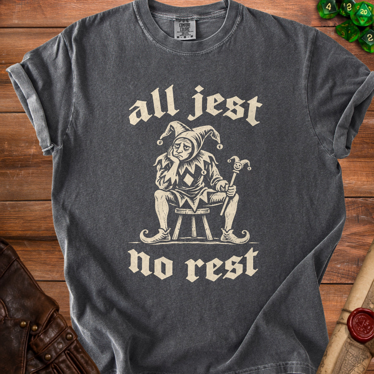 T-shirt with sad jester graphic and text "all jest no rest".