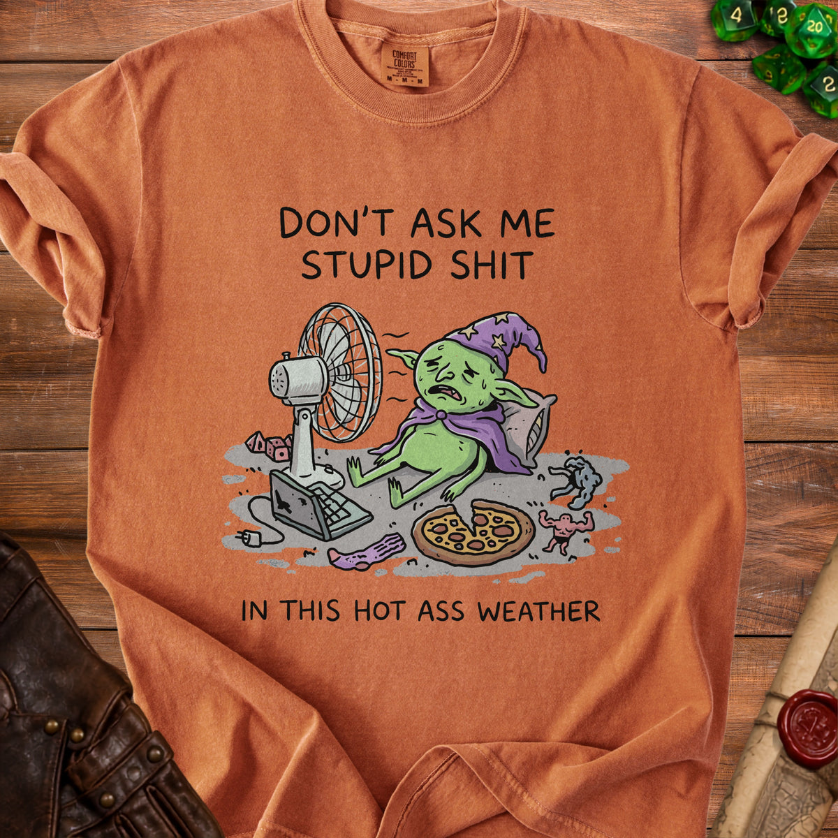 T-shirt with a distressed goblin fanning itself and text "Don't ask me stupid shit in this hot ass weather."