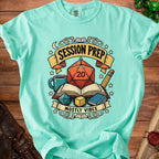 Teal t-shirt graphic with dice, books, and text "SESSION PREP MOSTLY VIBES."
