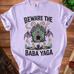 Lilac t-shirt with "Beware the Baba Yaga" text and illustration.