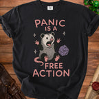 Black t-shirt with a panicked possum and dice, reading "Panic is a free action".