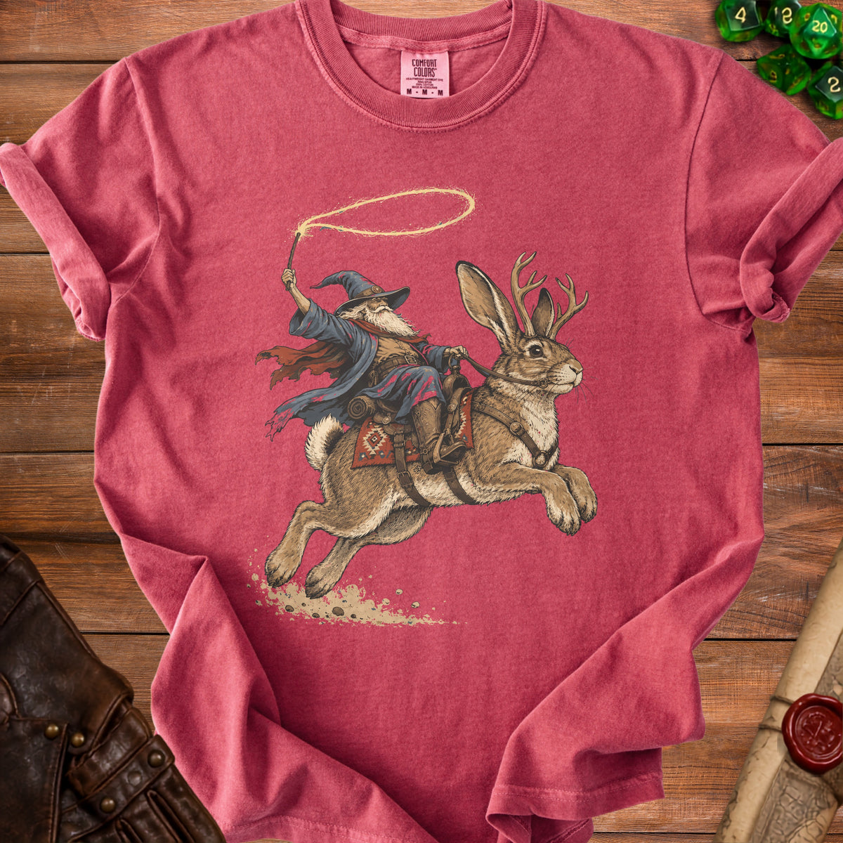Wizard riding a jackalope with a lasso and dice nearby.