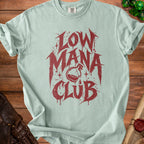 Light blue t-shirt with red "Low Mana Club" graphic and potion bottle illustration.