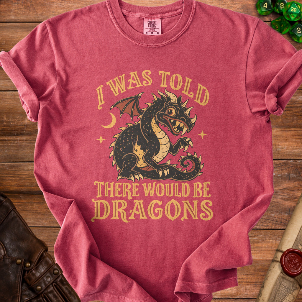 Red t-shirt with a vintage style dragon graphic and text "I WAS TOLD THERE WOULD BE DRAGONS".