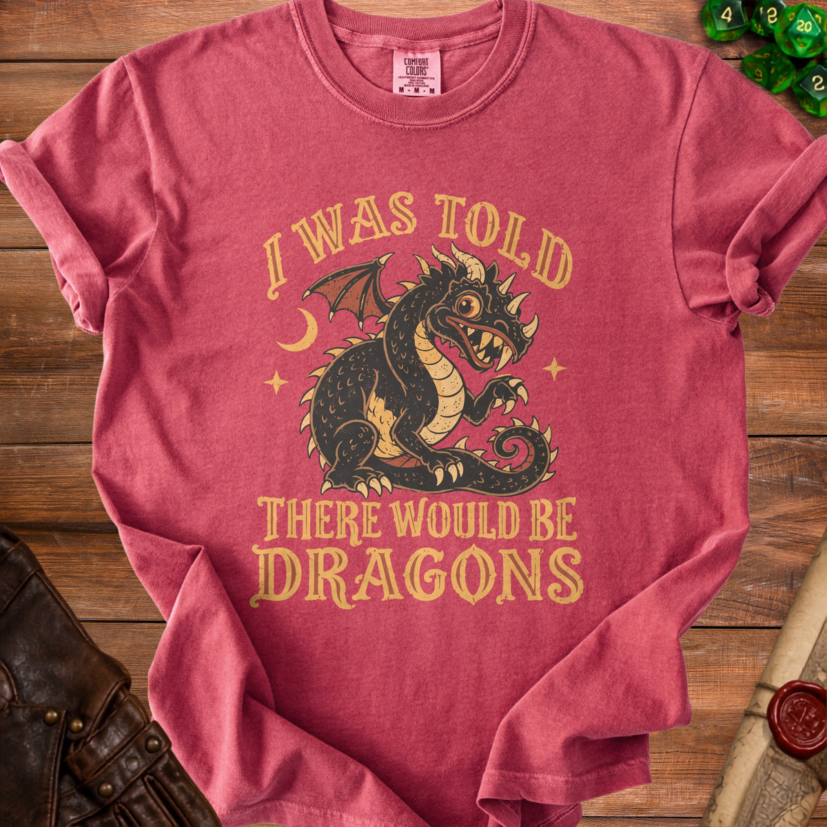 Red t-shirt with a vintage style dragon graphic and text "I WAS TOLD THERE WOULD BE DRAGONS".
