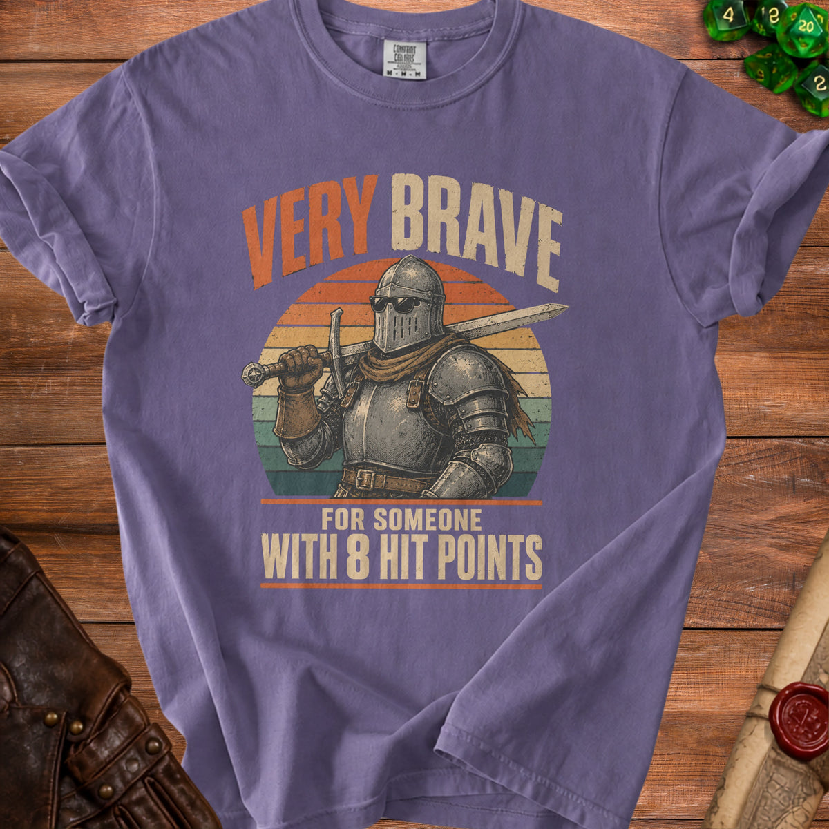 Purple t-shirt with knight graphic and text "VERY BRAVE FOR SOMEONE WITH 8 HIT POINTS".