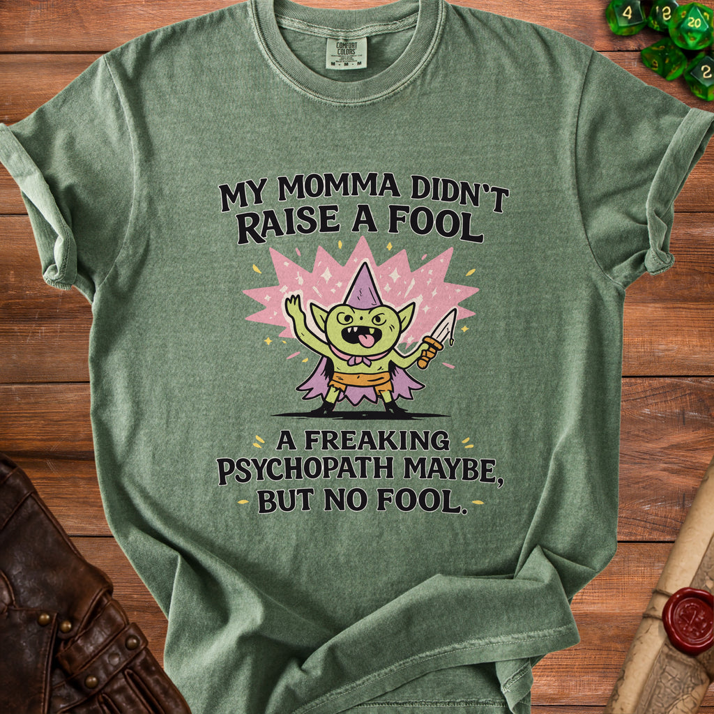 Green t-shirt with goblin graphic and text "My Momma Didn't Raise a Fool A Freaking Psychopath Maybe, But No Fool."