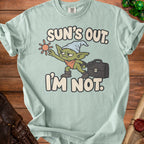 Mint green t-shirt with a goblin graphic and text "Sun's Out. I'm Not."