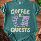 Teal t-shirt with "Coffee & Canceled Quests" text and icons of a drink and sword.