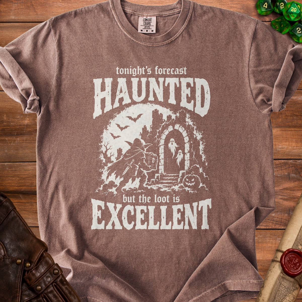Brown t-shirt with "tonight's forecast HAUNTED but the loot is EXCELLENT" text and Halloween graphics.