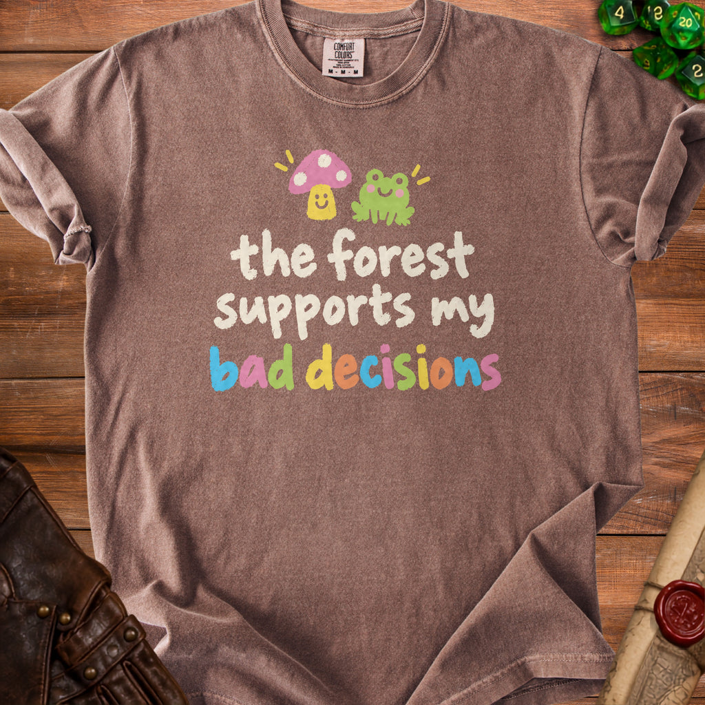 Brown t-shirt with frog, mushroom, and text "the forest supports my bad decisions".