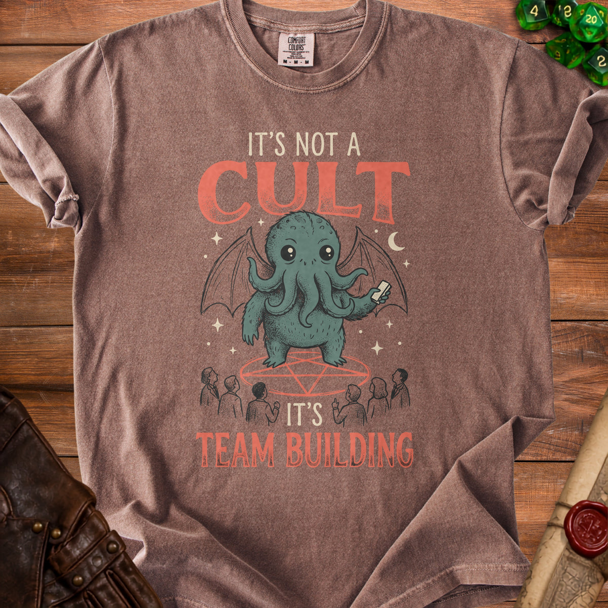Brown t-shirt with "It's Not A Cult, It's Team Building" text and a Cthulhu illustration.