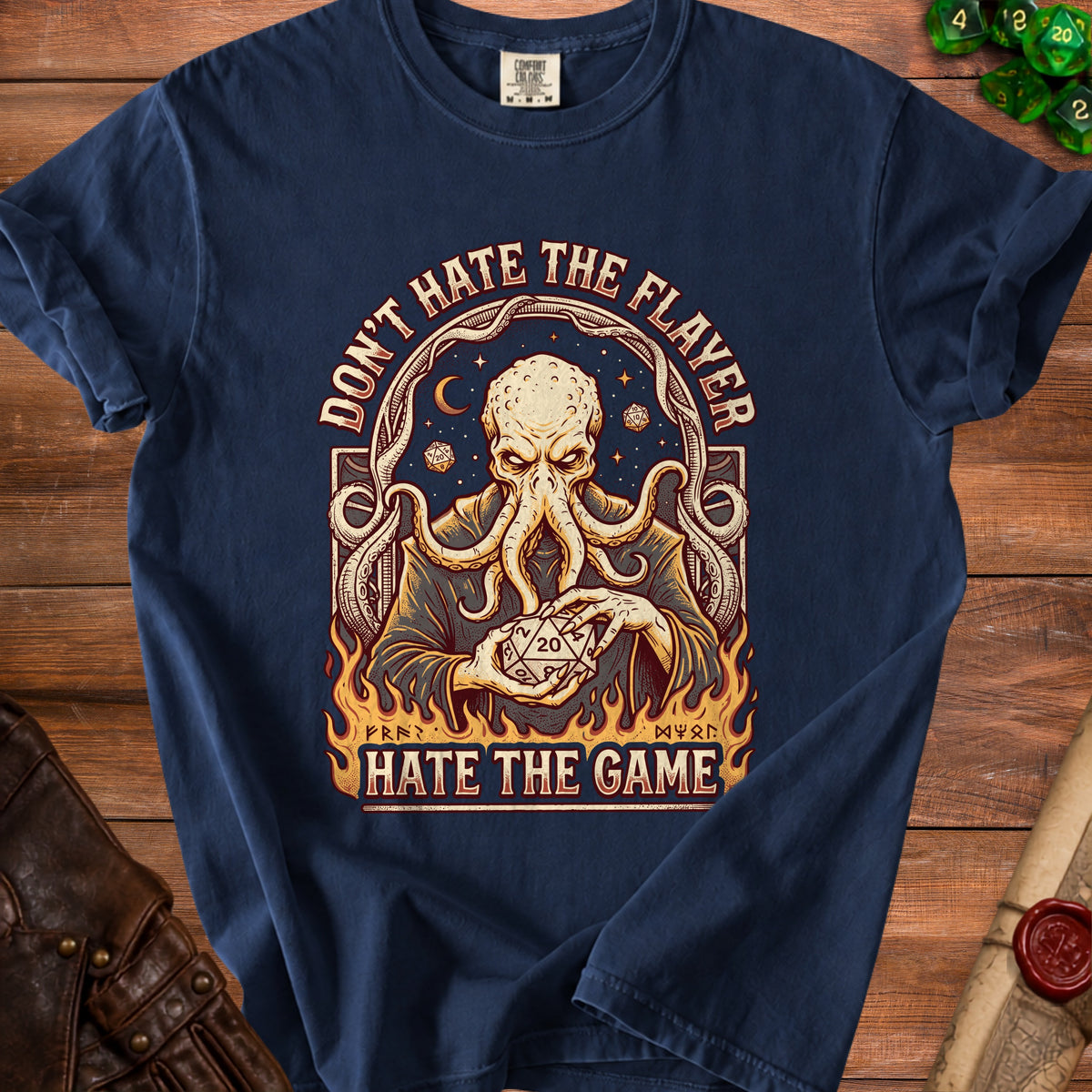 Dark blue t-shirt with a graphic of a tentacled creature holding a D20 die.