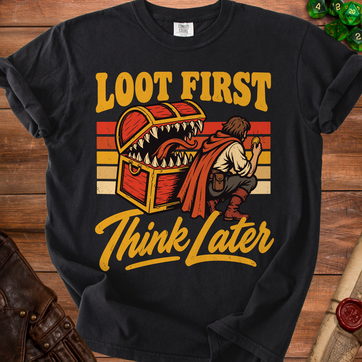 Black t-shirt with "Loot First Think Later" text and a treasure chest monster design.