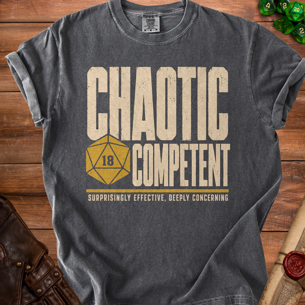 Charcoal t-shirt with "Chaotic Competent" and d20 dice graphic.