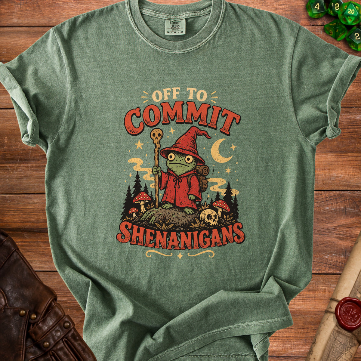 Green t-shirt with a frog wizard graphic saying "Off to Commit Shenanigans".