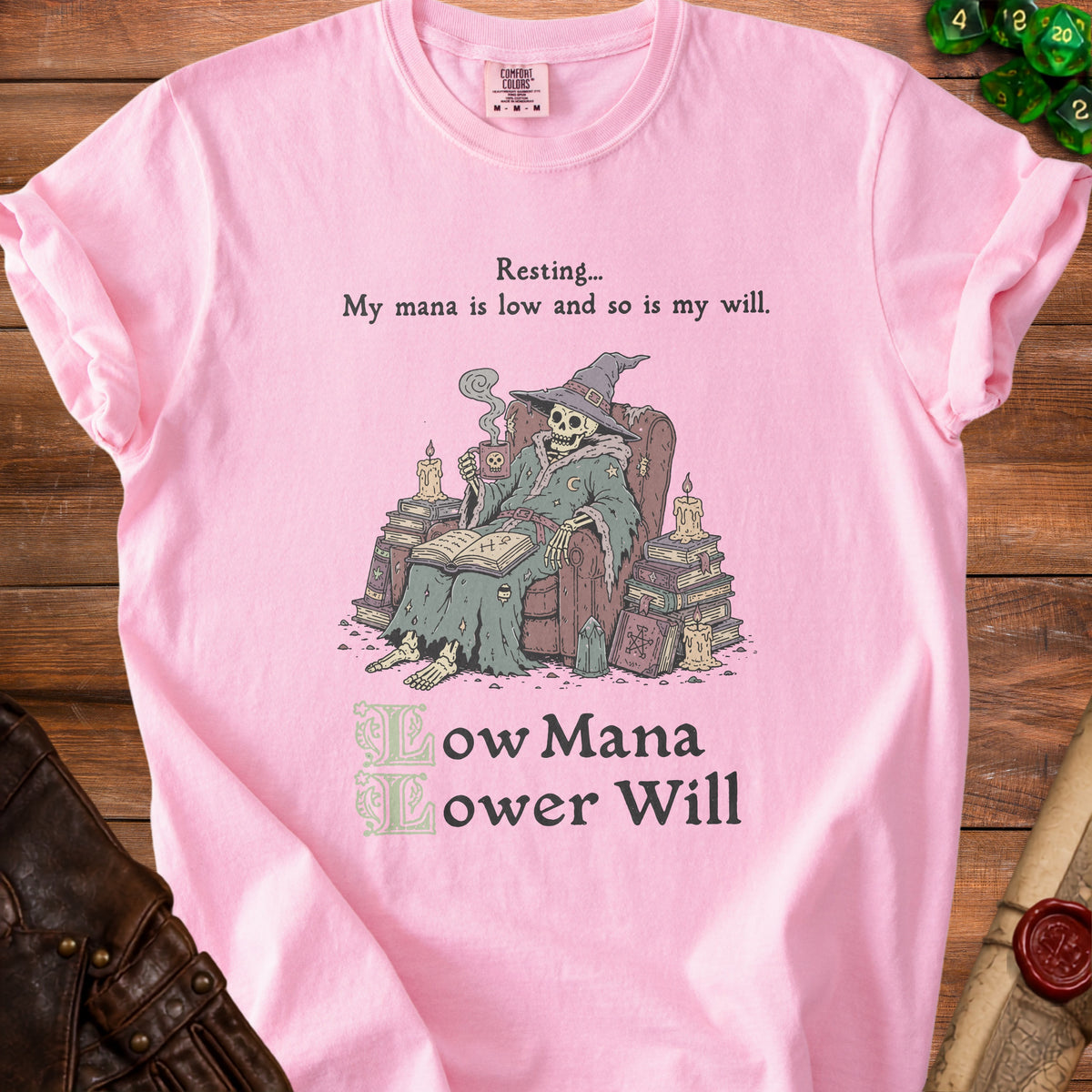 Pink t-shirt with skeleton wizard graphic and text "Resting... My mana is low and so is my will."