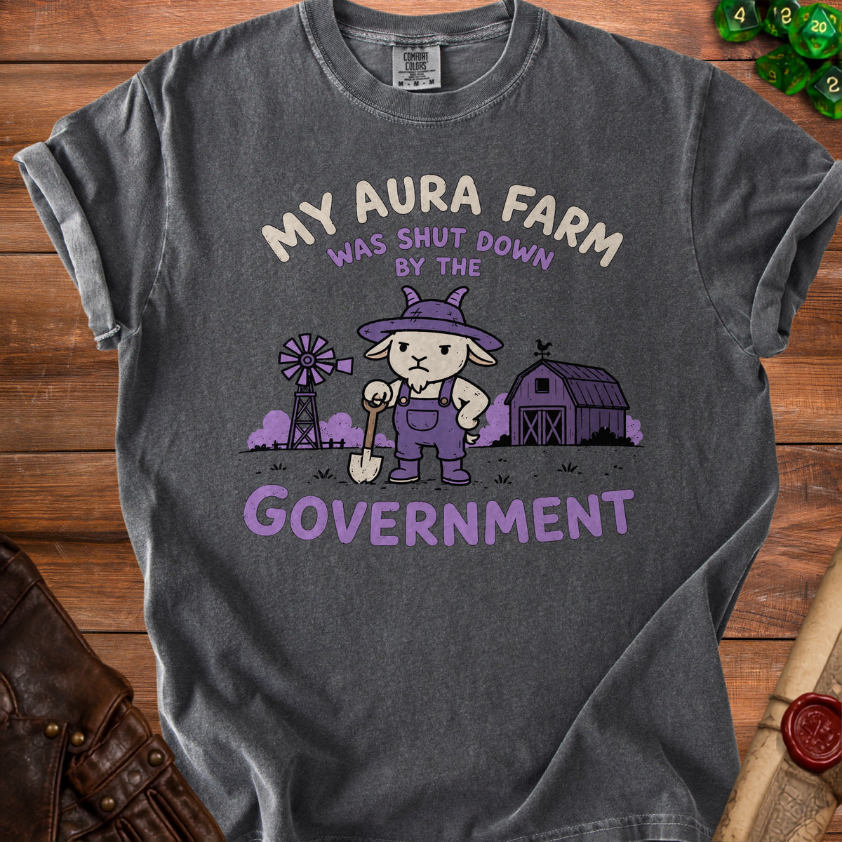 T-shirt with text "MY AURA FARM WAS SHUT DOWN BY THE GOVERNMENT" and goat graphic.