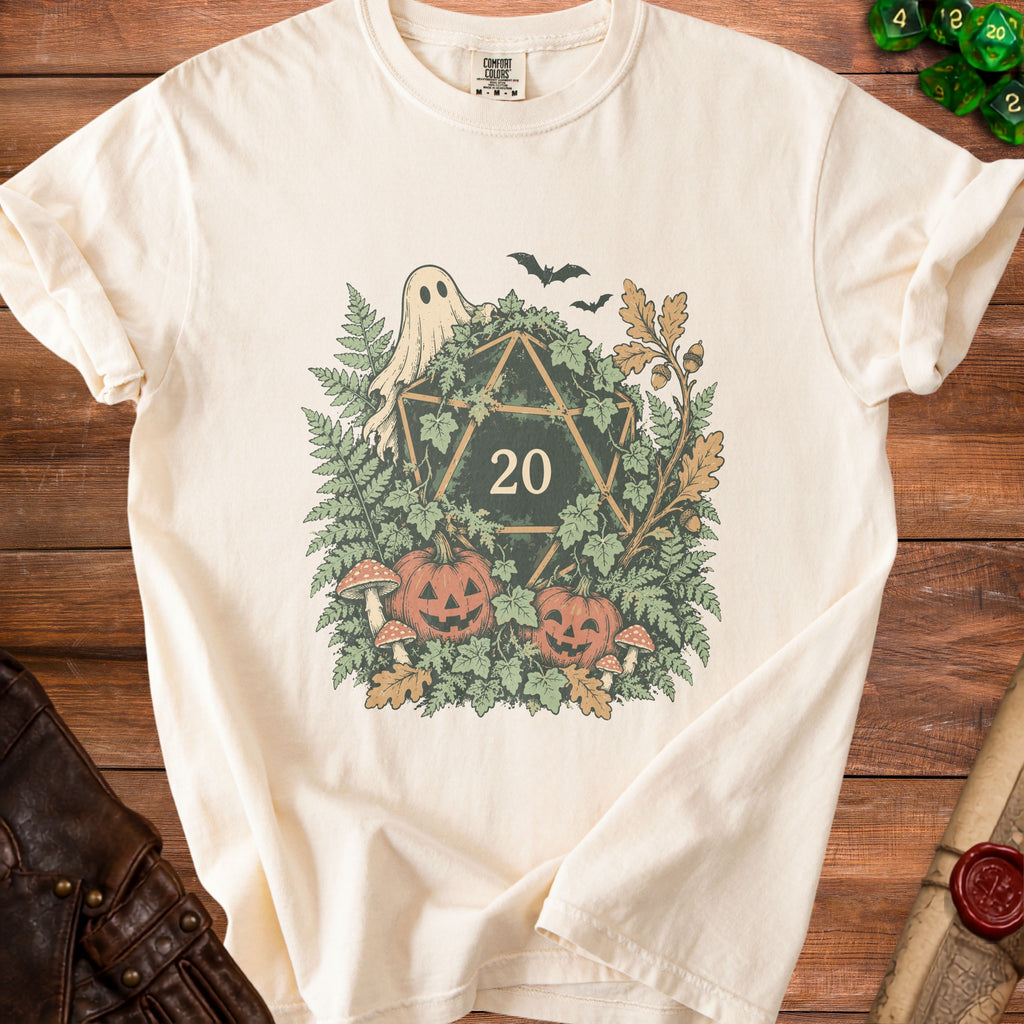 Cream t-shirt with Halloween-themed d20 graphic, featuring ghost, pumpkins, mushrooms, and bats.