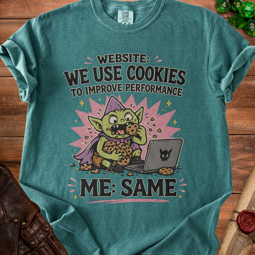Goblin eating cookies by laptop with text "WEBSITE: WE USE COOKIES ME: SAME".