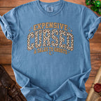 Blue t-shirt with "Expensive Cursed & Talks To Ghosts" text and leopard print.
