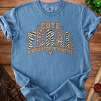 Blue t-shirt with "CUTE FERAL & ROLLS FOR INITIATIVE" text and dice graphics.