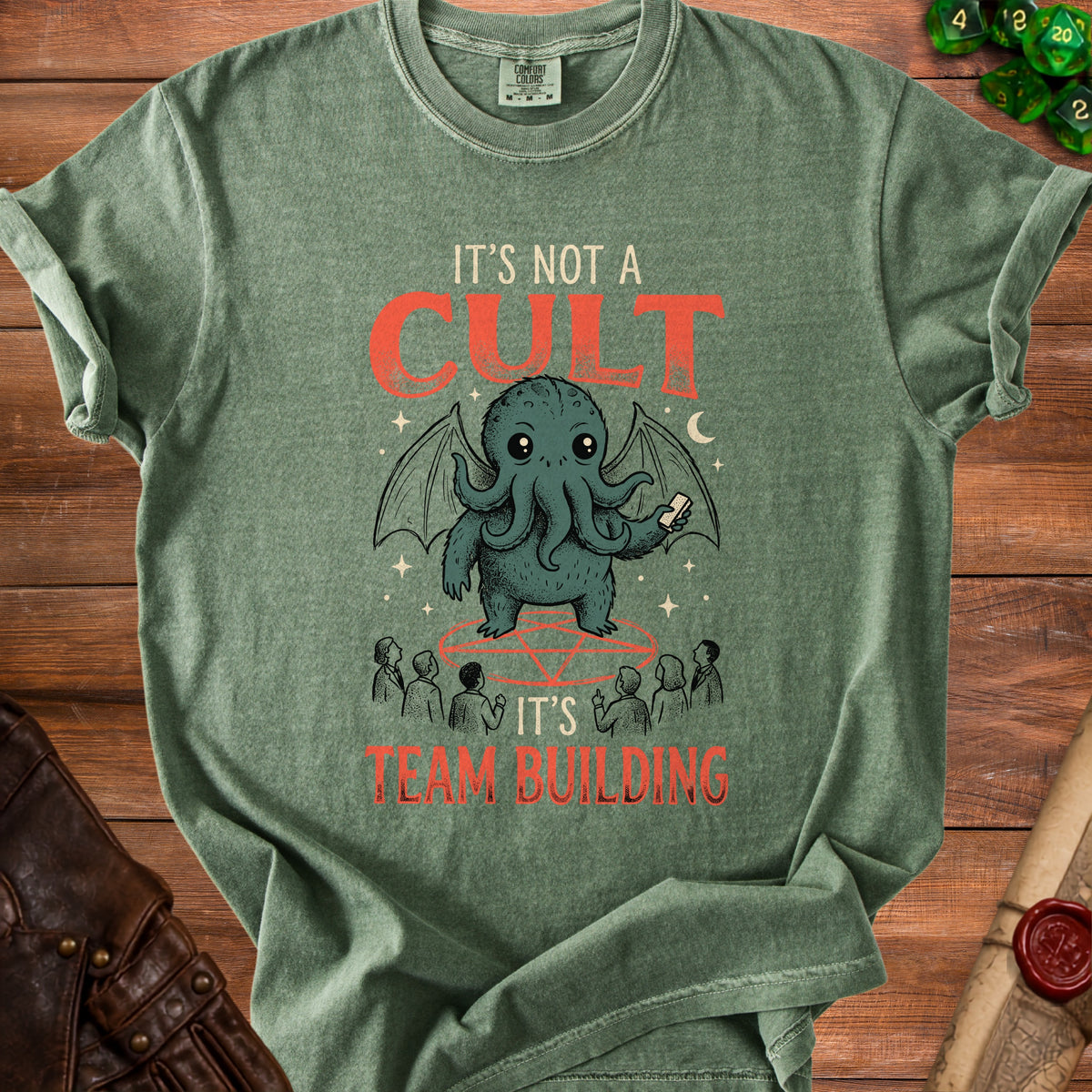 Green t-shirt with Cthulhu graphic and text "It's Not A Cult, It's Team Building".