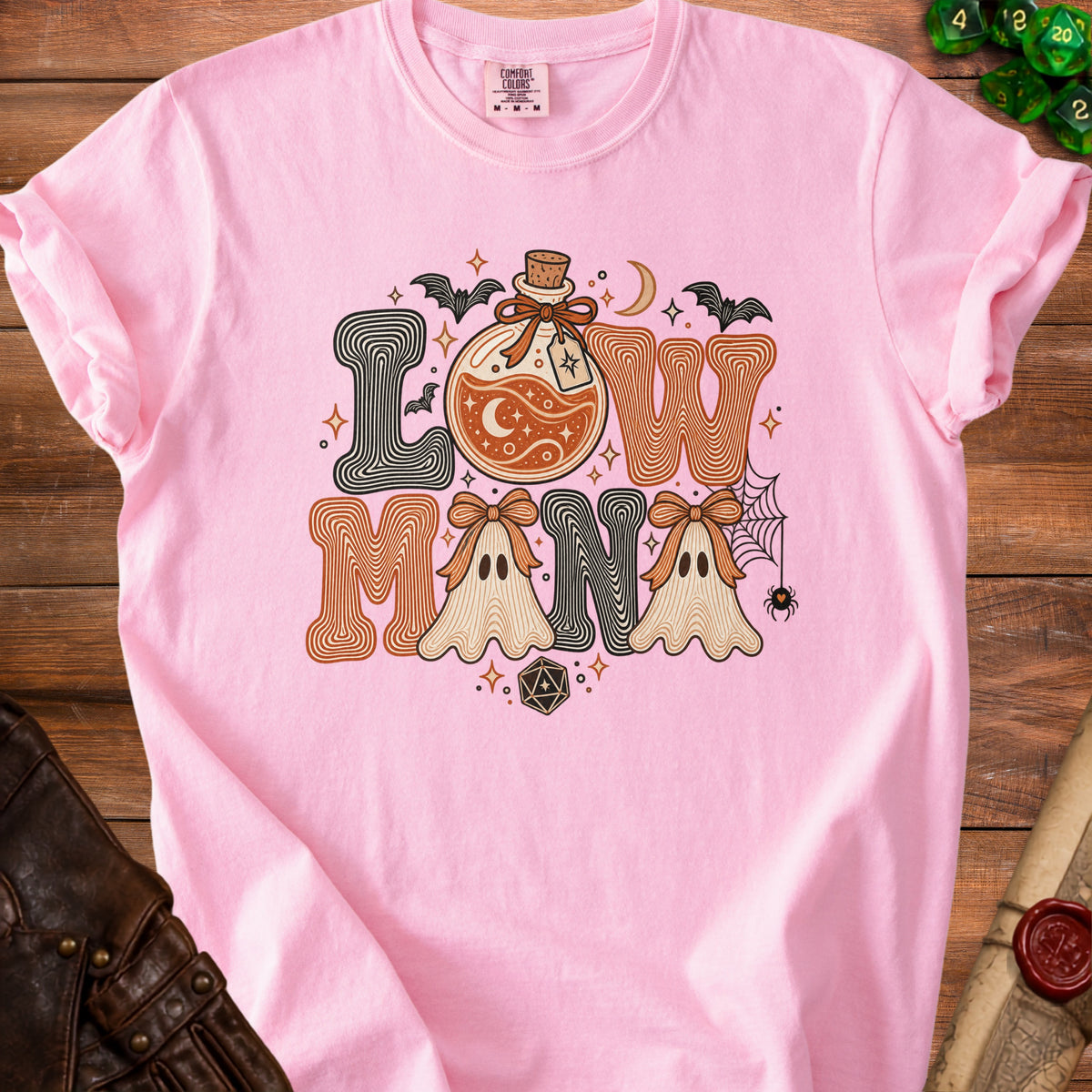 Pink t-shirt with "Low Mana" text, potion, ghosts, bats, and dice art.
