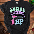 Black t-shirt with "Social Battery: 1 HP" text and a pixelated heart battery indicator.