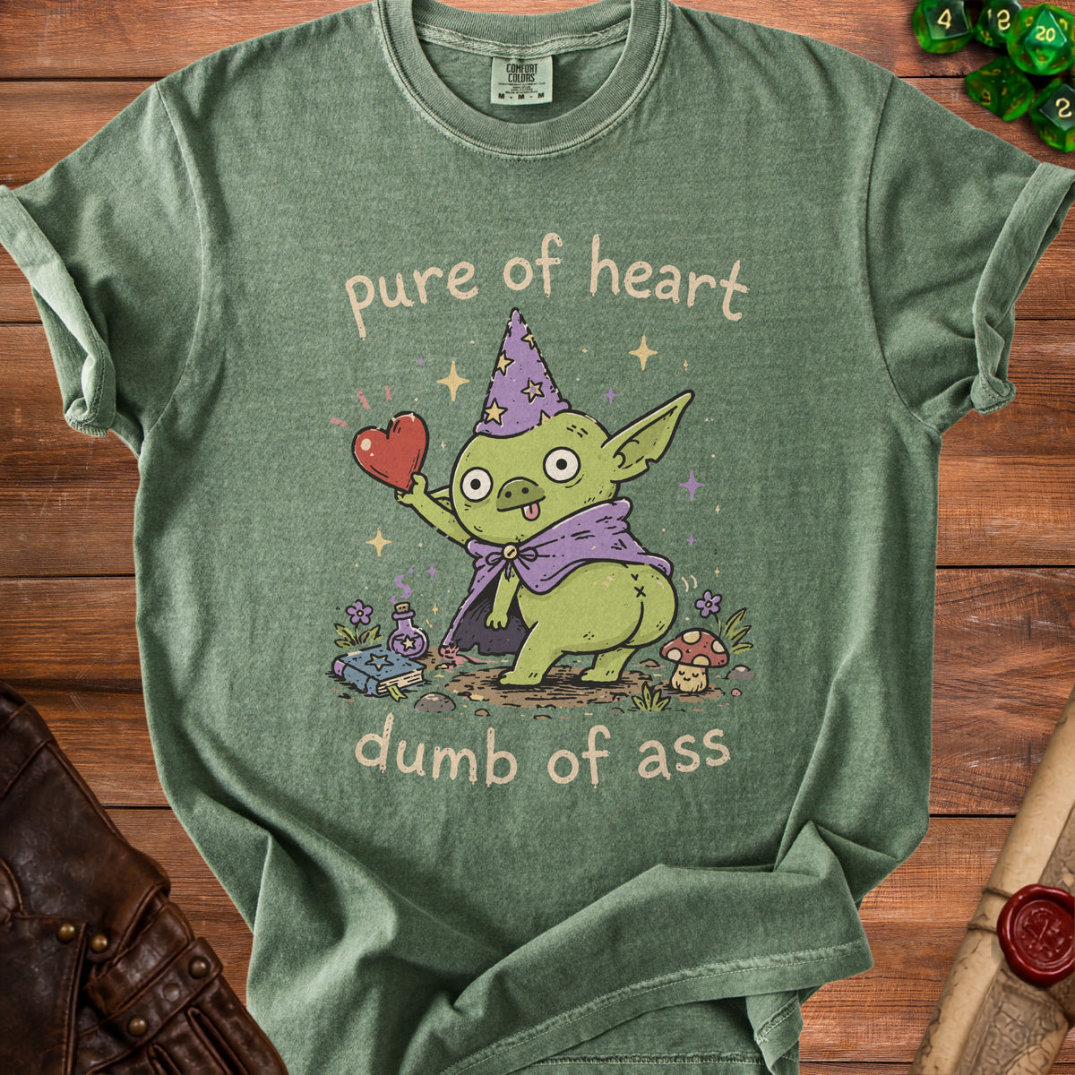 Green t-shirt with wizard goblin holding heart and text "pure of heart dumb of ass".