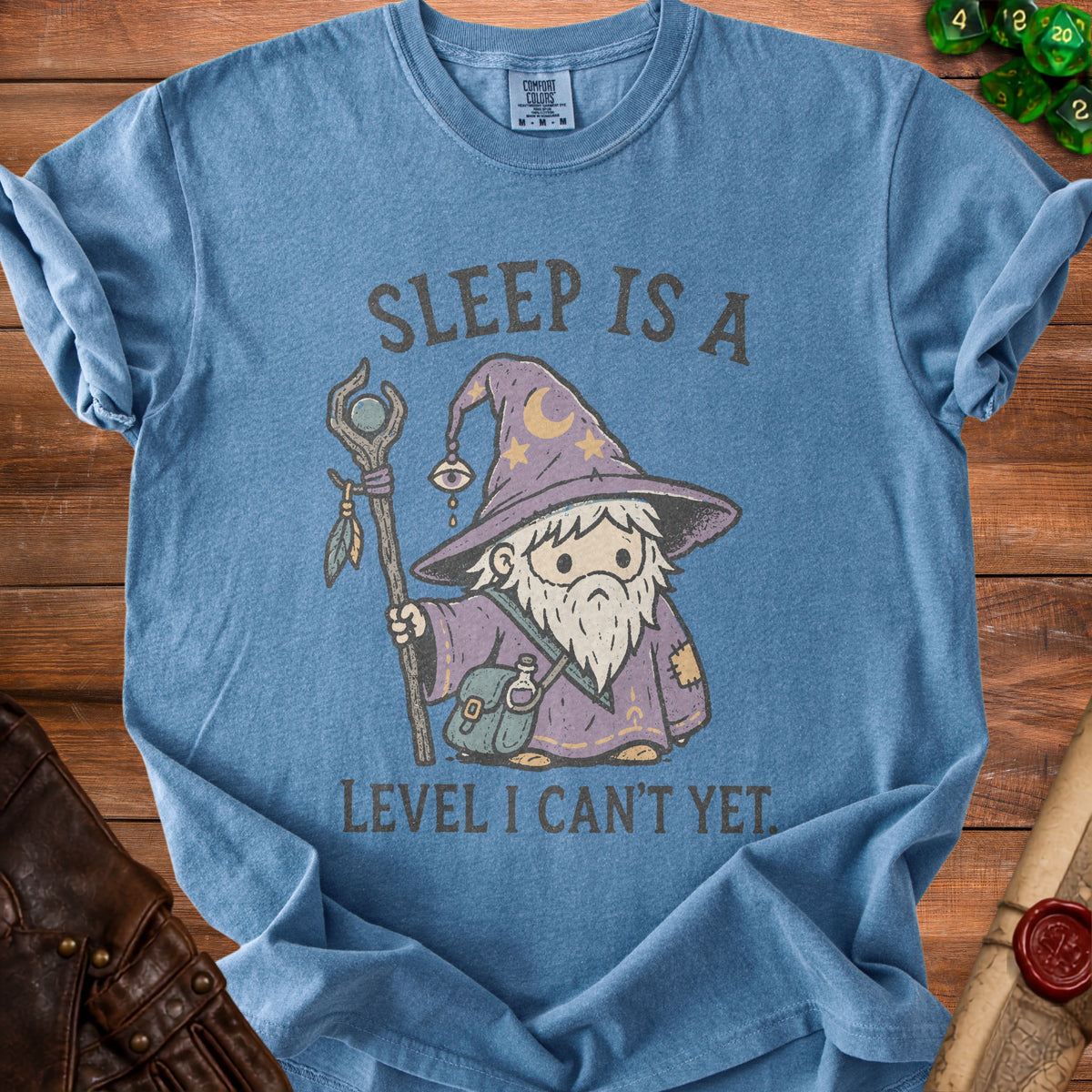 Blue t-shirt with wizard graphic and text "Sleep is a Level I Can't Yet".