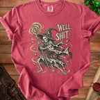Skeleton wizard with staff and hat, reads "Well, Shit..." on a red t-shirt.