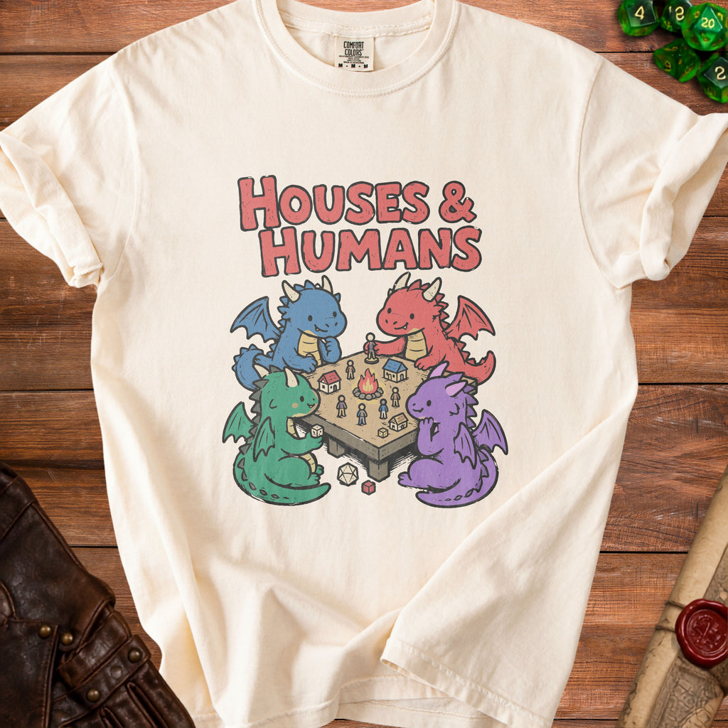 Cream t-shirt with "HOUSES & HUMANS" text and cartoon dragons playing a board game.