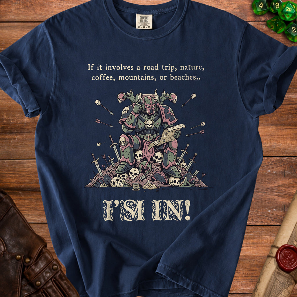 T-shirt with illustration of armored figure, skulls, and text "If it involves a road trip... I'M IN!".