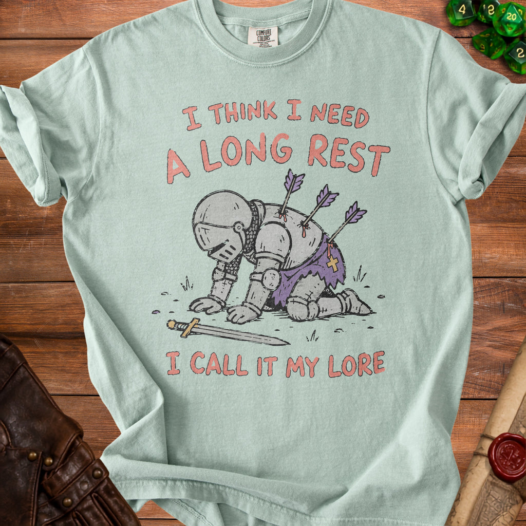 Light blue t-shirt with a knight pierced by arrows and text "I THINK I NEED A LONG REST I CALL IT MY LORE".