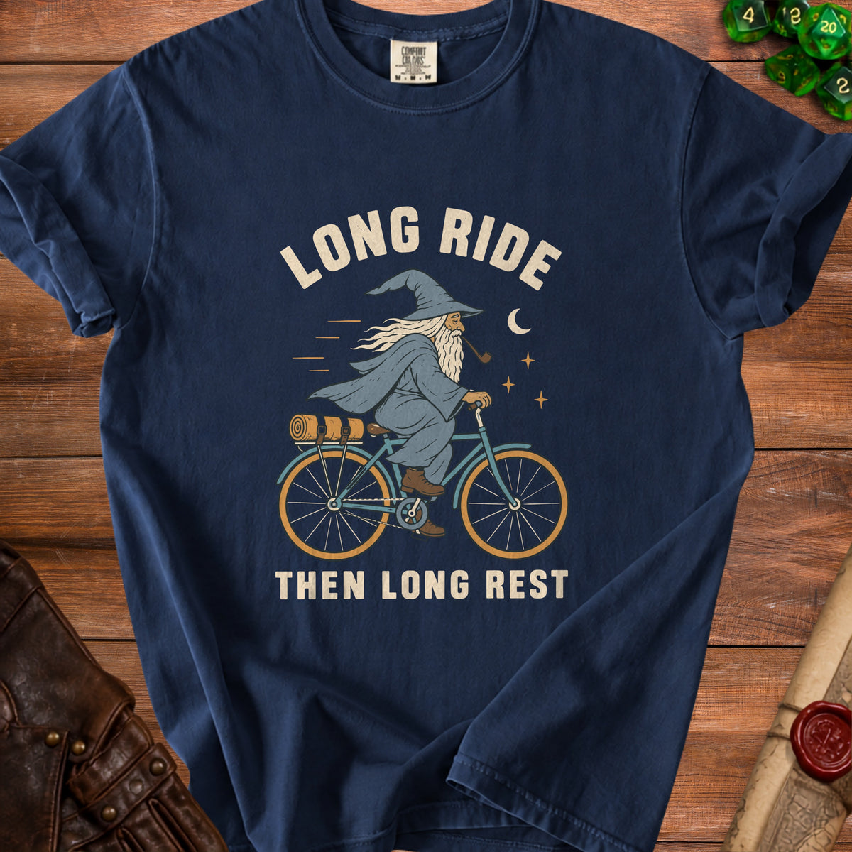 Wizard on bicycle with pipe and baggage, "Long Ride Then Long Rest" text.