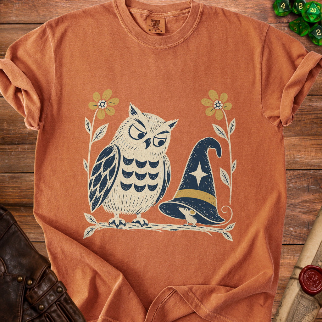 T-shirt with owl, mouse, witch hat, and flowers graphic.