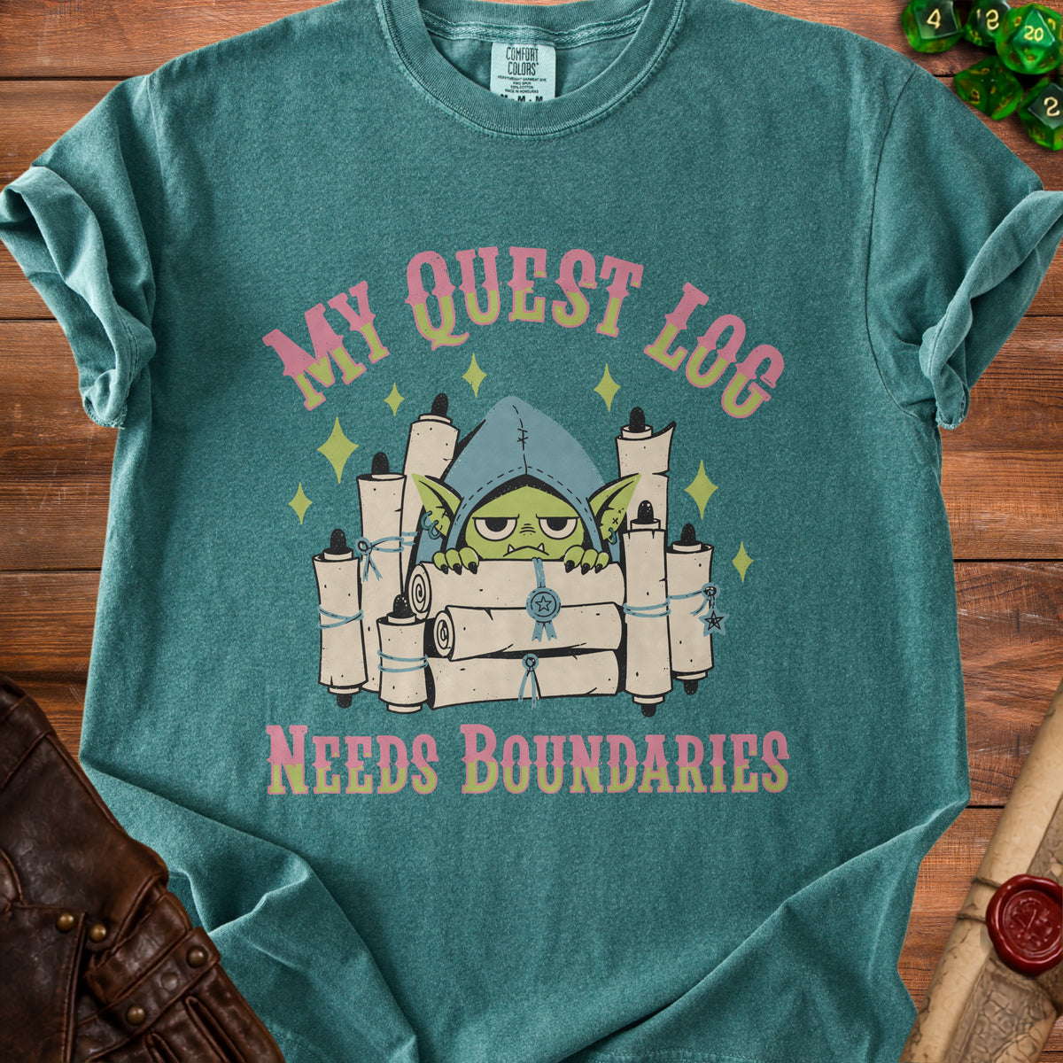 Green t-shirt with goblin holding scrolls and text "MY QUEST LOG NEEDS BOUNDARIES".