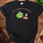 Black t-shirt with a cartoon frog in a witch hat, a ghost, and an open book.