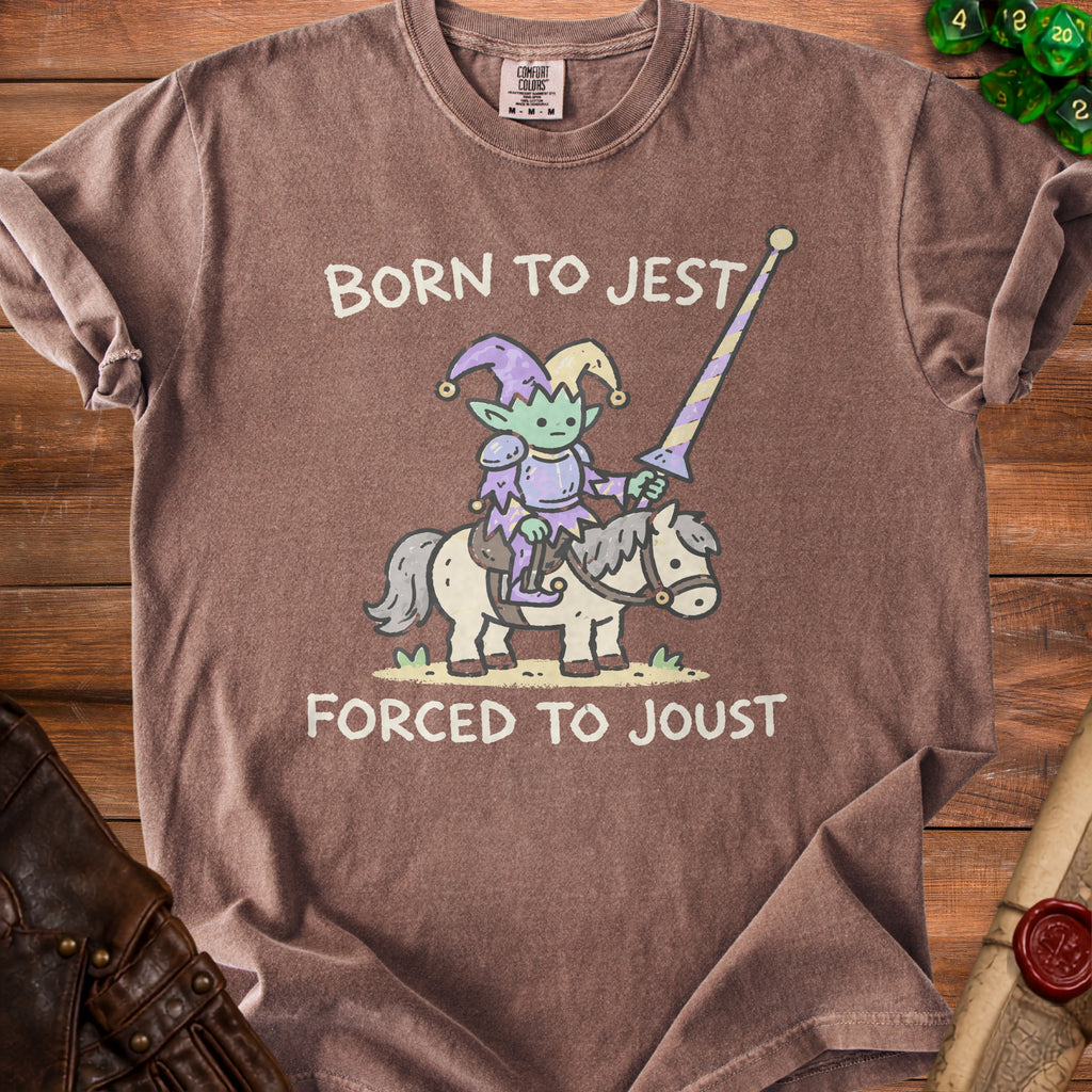 Brown t-shirt with cartoon elf jester riding a horse, text "BORN TO JEST FORCED TO JOUST".