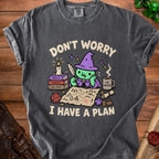 T-shirt with cartoon wizard planning with map, dice, and coffee. Text: "Don't Worry, I Have a Plan".