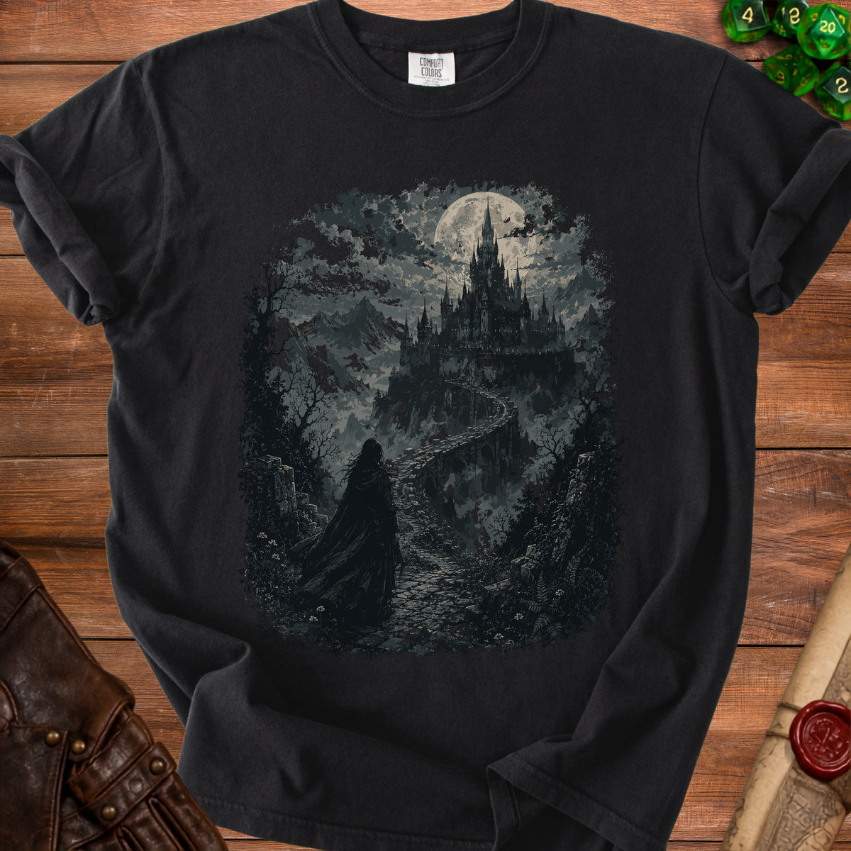 Black t-shirt with dark fantasy art of a cloaked figure approaching a moonlit castle.